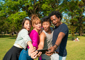 Friends having fun while taking selfies