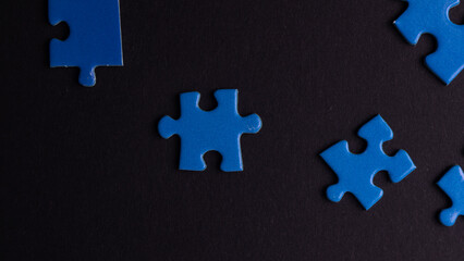 scattered puzzle pieces on colored background