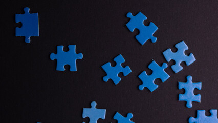 scattered puzzle pieces on colored background