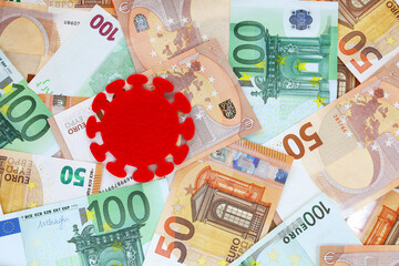 Red felt covid virus on 50 and 100 euro banknotes background. Coronavirus pandemic in Europe. Financial crisis, bank, money, economy, business concept. Place for text. - obrazy, fototapety, plakaty