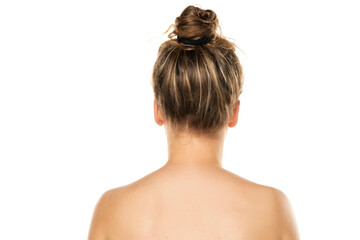 rear view of a blond woman with bun