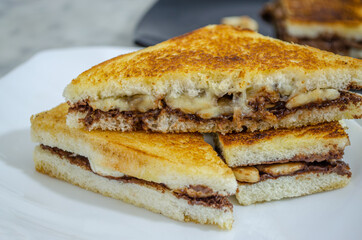 Ready-to-Eat, Yummy, Chocolate Banana Sandwich pieces in a plate. Macro Shot