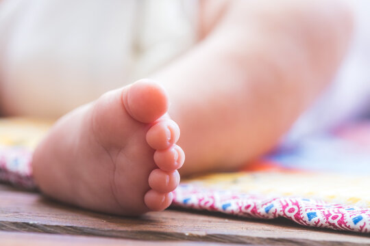Baby and newborn concept: Close up of newborn baby feet outdoors