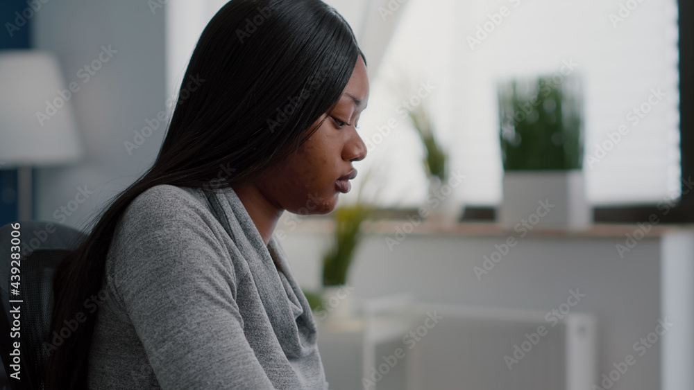 Poster african american student sitting at desk typing communication project on computer searching informat