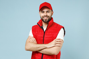 Professional calm delivery guy employee man in red cap white T-shirt vest uniform workwear work as...