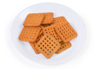 Flat crunchy square-shaped sugar shortbread cookies on dish
