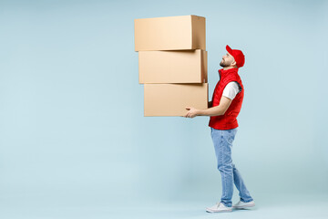 Full size body length delivery guy employee man in red cap white T-shirt vest uniform work as...