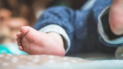 Baby and newborn concept: Close up of newborn baby feet on baby blanket