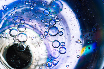 Colorful oil drops in water abstract background