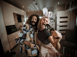 Foto op Canvas Funny couple spending time together at home © konradbak