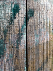 Colorful paint peeled off on old wooden fence