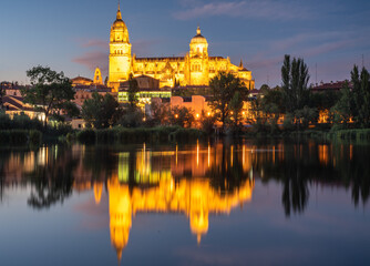 Fototapeta na wymiar view of the cathedral of Salamanca in Spain reflected in the river tormes.