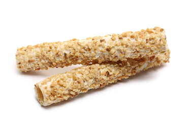 Waffle rolls with chocolate filling in peanut glaze isolated on white background