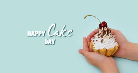 World Cake Day. A delicious cream cake with a cherry in the hands of a child on a blue background. A greeting card or banner for a store or website sale.