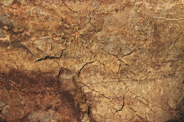 石テクスチャー ヒビの入った茶色い岩肌