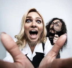 Foto op Plexiglas anti-reflex Funny hipster couple posing on white background © konradbak