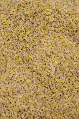 Close-up bulgur grains. Bulgur as a background texture