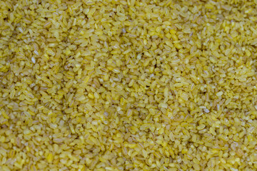 Close-up bulgur grains. Bulgur as a background texture