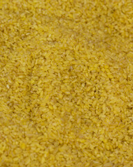 Close-up grains of bulgur for rice. Bulgur as a background texture