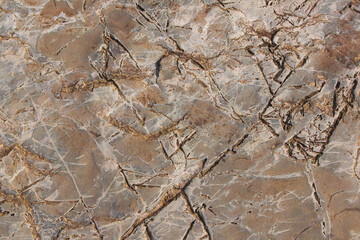 Obraz na płótnie Canvas 石テクスチャー 薄茶色のヒビの入った岩