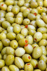 Pepper Stuffed Green Olives. Close up. Green olives as background texture