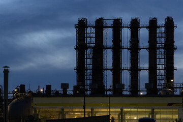 A distillation column at an oil refinery for the production of gasoline.