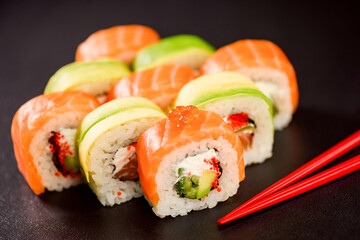 uramaki sushi roll with salmon, avocado, cream cheese philadelphia