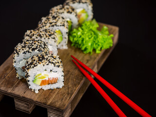 Uramaki Sushi Roll with salmon fish, avocado and cream cheese philadelphia