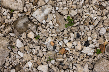 The texture of stones with jagged edges. Lots of small stones.