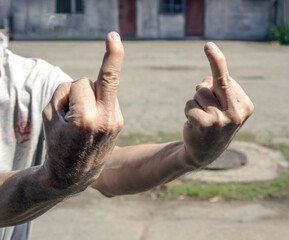 A human finger with an offensive gesture.                      