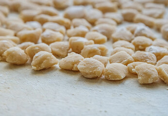 dough close-up on a plastic board sprinkled with flour