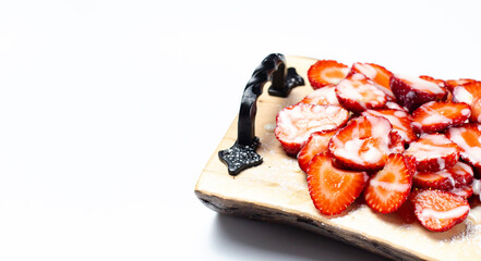 Strawberries on a wooden tray. Dessert. On white background.