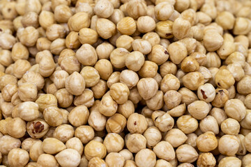 Roasted hazelnut kernels. close up. Roasted hazelnuts as background texture