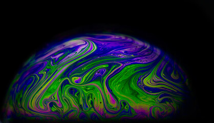 abstract colourful background with patterns and rainbow effects in soap and bubbles.