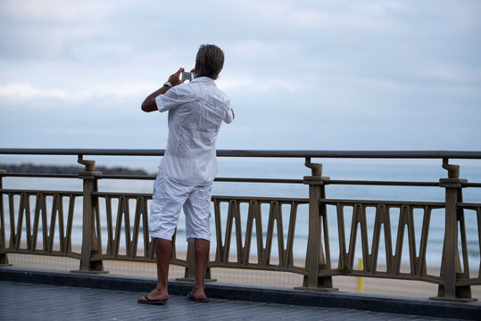 man taking pictures in the city