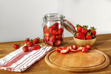 Fresh red fruits on table and wall with shadows 
