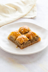 Baklava with Walnut. Turkish baklava on a white background. Local name cevizli baklava