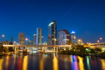 Tampa skyline at night with Hillsborough river in the foreground