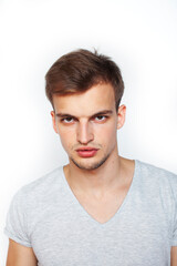 Obraz premium young handsome teenage hipster guy posing emotional, happy smiling against white background isolated, lifestyle people concept