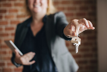 Real estate agent handing over the keys