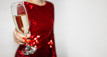 Cheer celebration. Holiday drink. Party congrats. Advertising background. Unrecognizable woman red paillette dress greeting with champagne flute isolated white copy space.