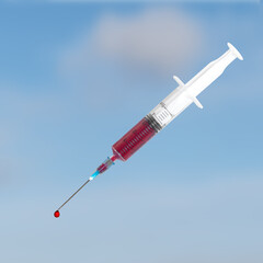 A single use syringe with blood and droplet over sky.