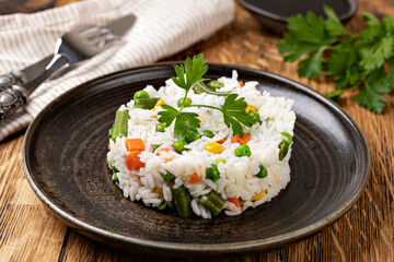 Bowl with tasty rice and vegetables