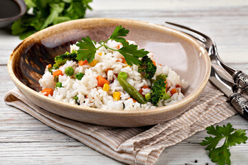 Bowl with tasty rice and vegetables
