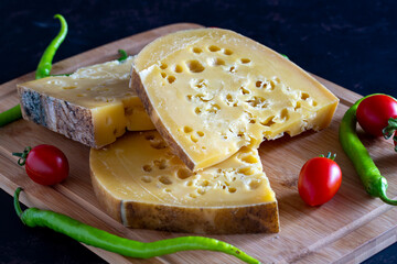Gruyere cheese. Piece of aged Comte or Gruyere de Comte. Traditional Turkish gruyere cheese