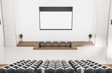 Contemporary concrete auditorium interior with empty banner, seatings and daylight. Workshop...