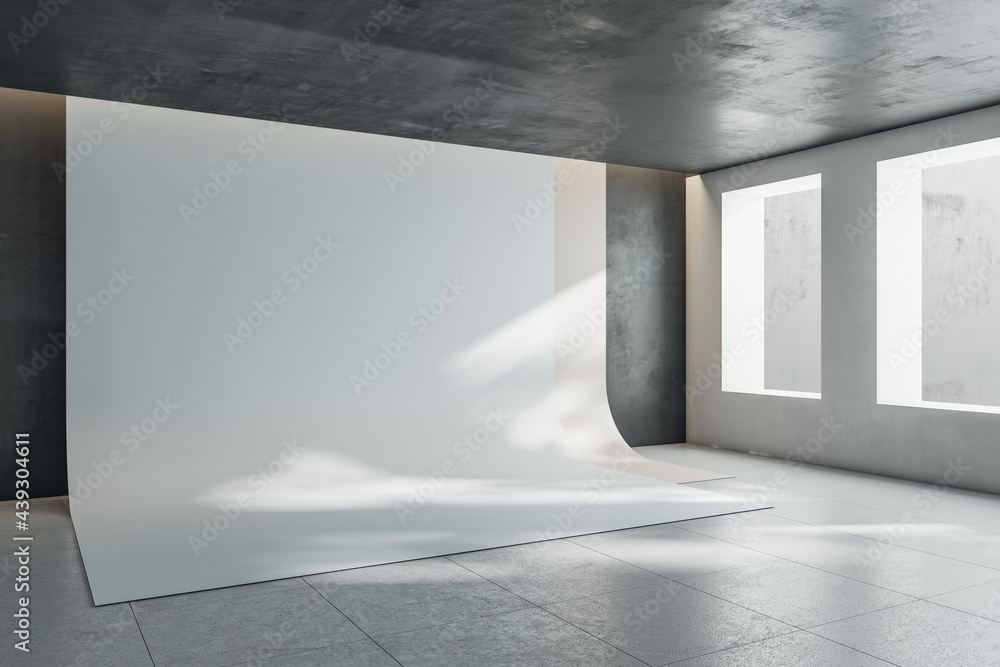 Poster perspective view on blank white backdrop in photo studio with windows, dark ceiling, wall and glossy
