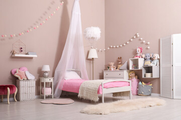 Cute child's room interior with toys and modern furniture