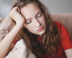 Portrait of a sad teenage girl looking thoughtful