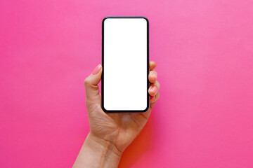 Mobile phone with empty white screen in hand on bright pink background
